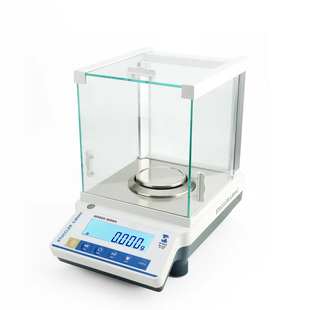 Angled view of Stuccler SE-R62Q 1mg precision balance with glass draft shield and digital display.