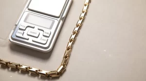 Next to the gold chain was a small digital scale with several buttons
