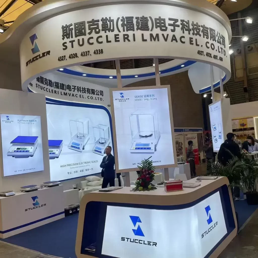 Stuccler precision electronic balance booth at international trade show.