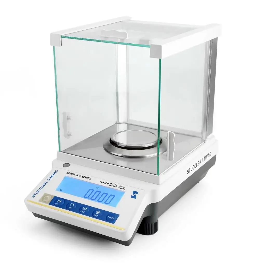 Stuccler analytical precision carat scale featuring a three-door glass draft shield enclosure and digital display.